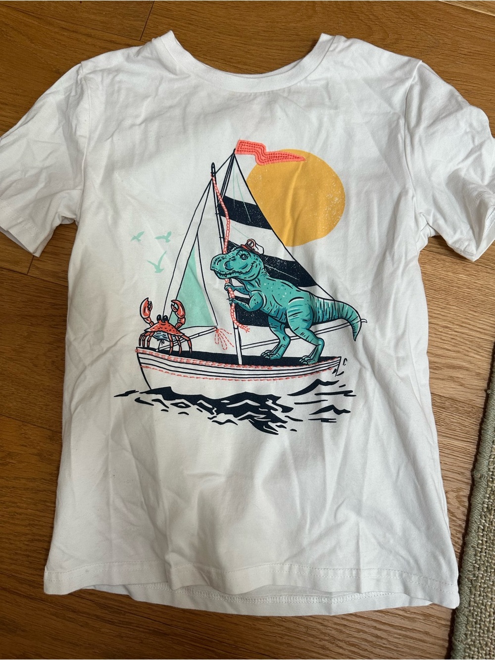 Tommy Bahama White Kids Tee with Teal Dino & Yellow Sun Sailboat